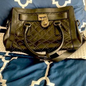 This is a black Michael Kors purse/hand bag
